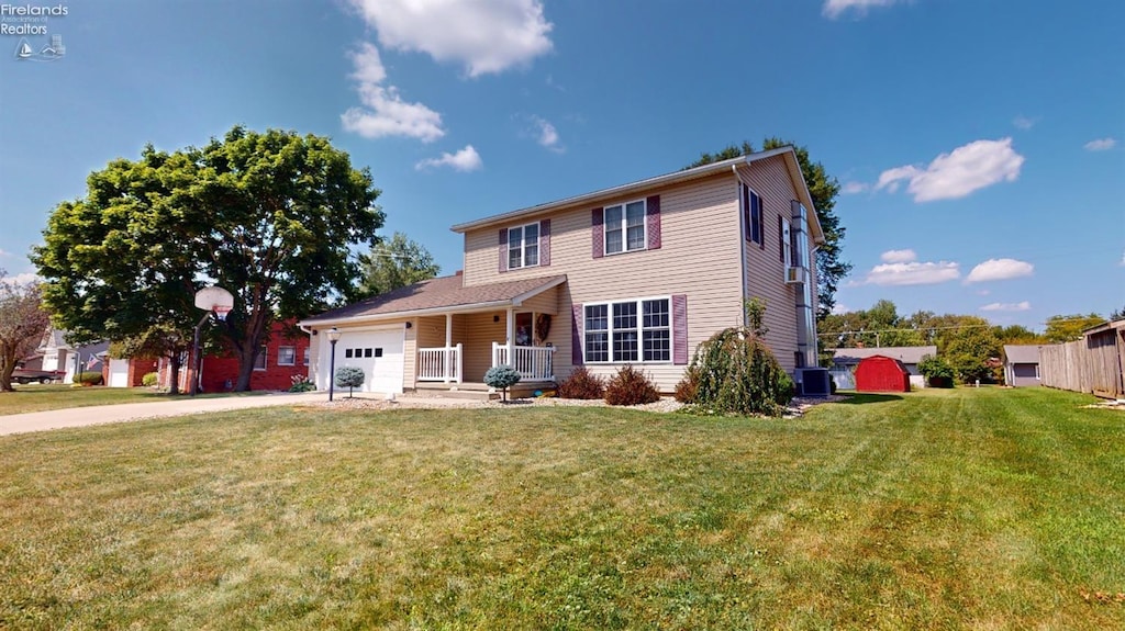 view of front of home featuring a porch, a garage, central AC unit, and a front lawn