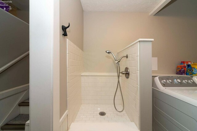 carpeted bedroom with ceiling fan and a textured ceiling