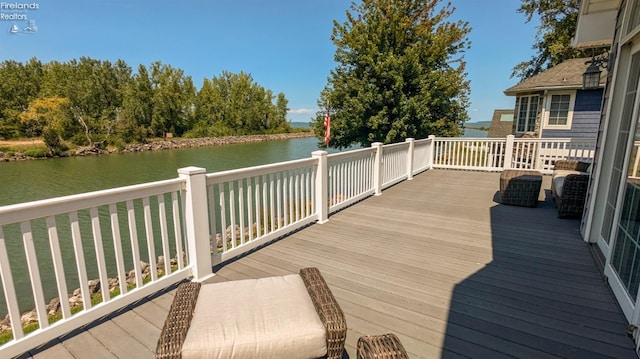 wooden terrace with a water view