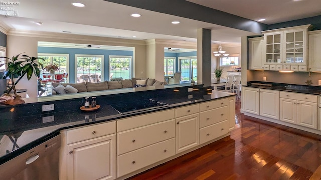 kitchen featuring white cabinetry, black electric stovetop, ornamental molding, and stainless steel dishwasher