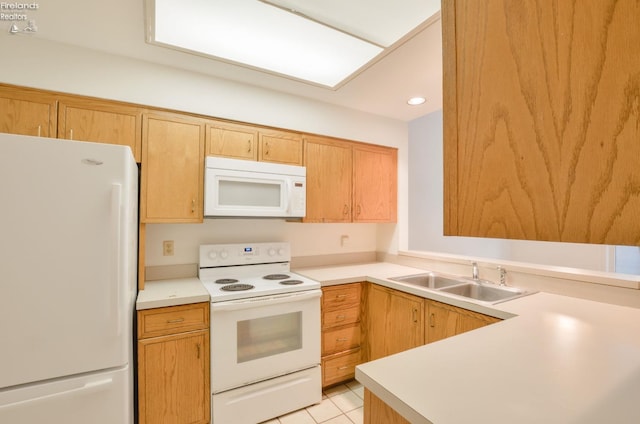 kitchen with sink, light tile patterned flooring, and white appliances