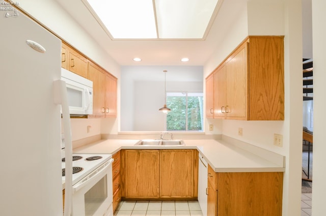 kitchen with sink, a skylight, white appliances, light tile patterned floors, and pendant lighting