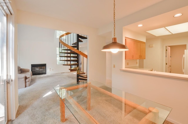 carpeted dining space featuring a wealth of natural light