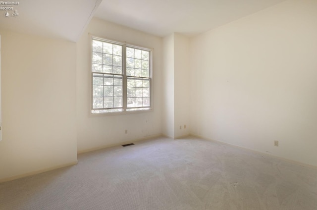 spare room featuring carpet flooring