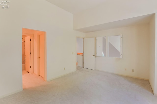 empty room with light colored carpet