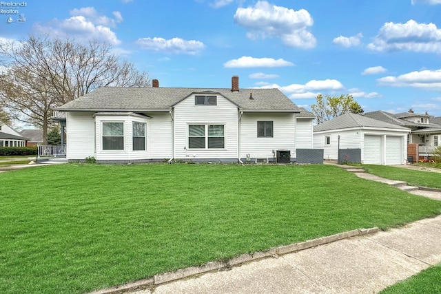 view of front facade featuring a front yard and a garage