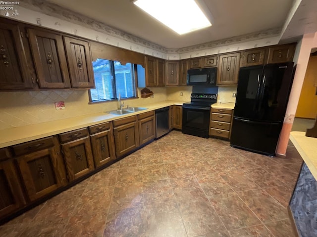 kitchen with sink, black appliances, dark brown cabinetry, and light tile patterned floors