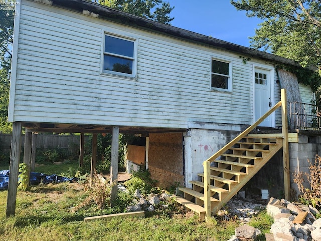 back of property featuring stairway