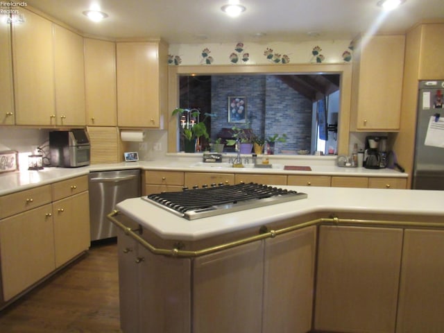 kitchen with stainless steel appliances, dark hardwood / wood-style floors, sink, and light brown cabinetry