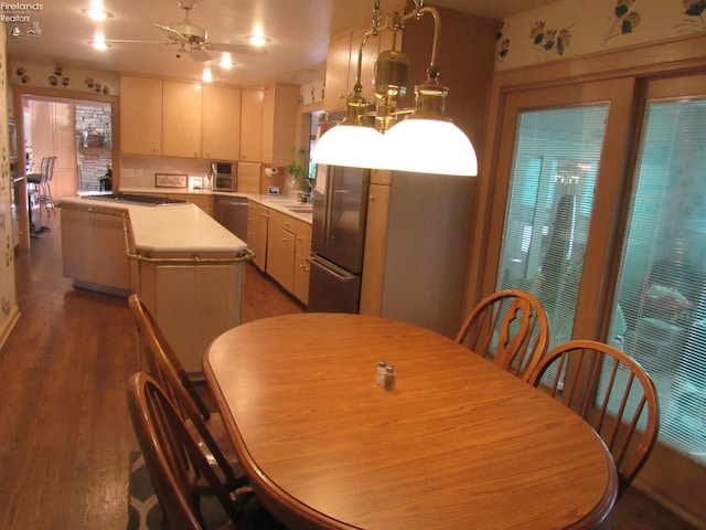 dining area featuring dark hardwood / wood-style flooring and ceiling fan