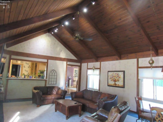 carpeted living room featuring a wealth of natural light, ceiling fan, wooden ceiling, and lofted ceiling with beams