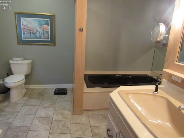 bathroom featuring vanity, toilet, and tile patterned floors