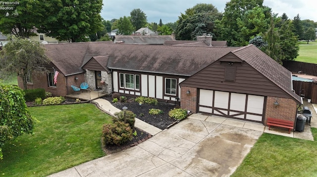 view of front of home featuring a garage and a front yard