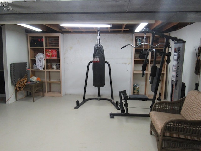 exercise area featuring concrete flooring