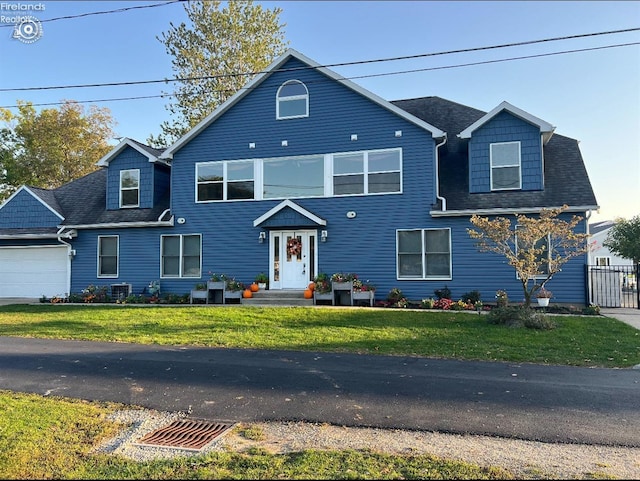 1909 N Nan Ave, Marblehead, OH 43440 - view of front of home featuring roof with shingles and a garage