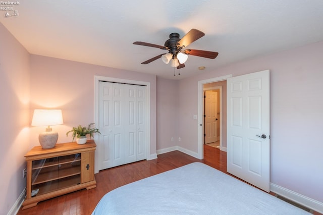1909 N Nan Ave, Marblehead, OH 43440 - bedroom featuring baseboards, wood finished floors, a closet, and a ceiling fan