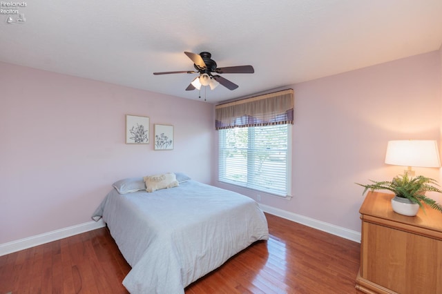 1909 N Nan Ave, Marblehead, OH 43440 - bedroom with baseboards, wood finished floors, and ceiling fan