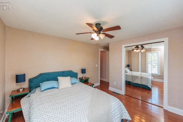 1909 N Nan Ave, Marblehead, OH 43440 - bedroom with wood finished floors, a closet, baseboards, and ceiling fan