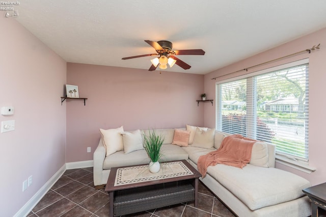 1909 N Nan Ave, Marblehead, OH 43440 - tiled living area with ceiling fan and baseboards