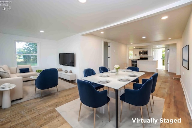 dining room featuring light hardwood / wood-style floors