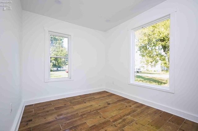 empty room featuring dark wood-type flooring