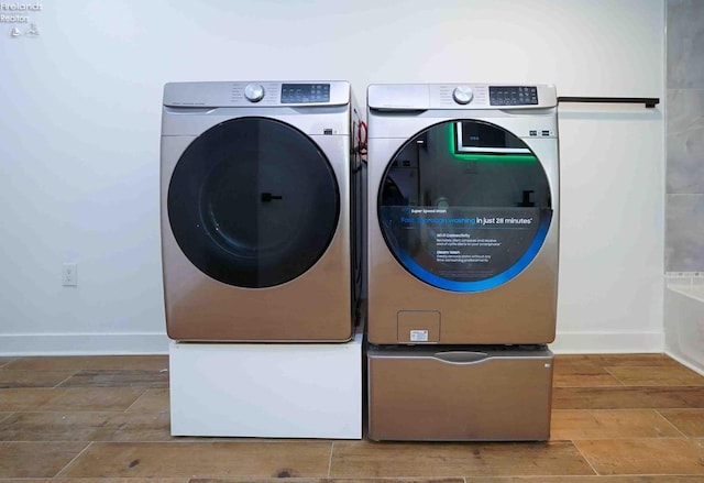 washroom featuring independent washer and dryer