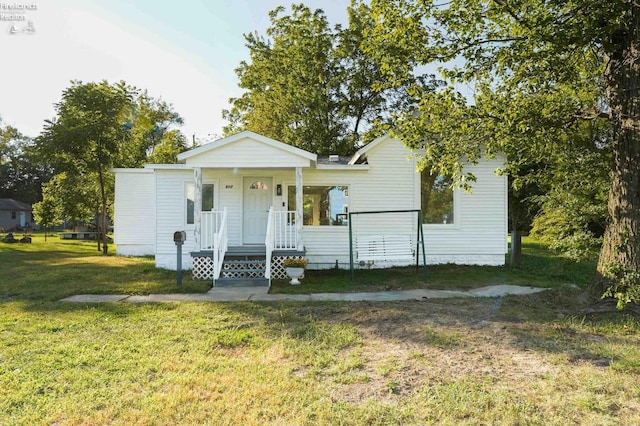 view of front of home with a front lawn and covered porch