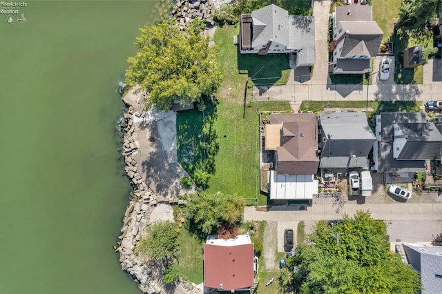 birds eye view of property featuring a water view