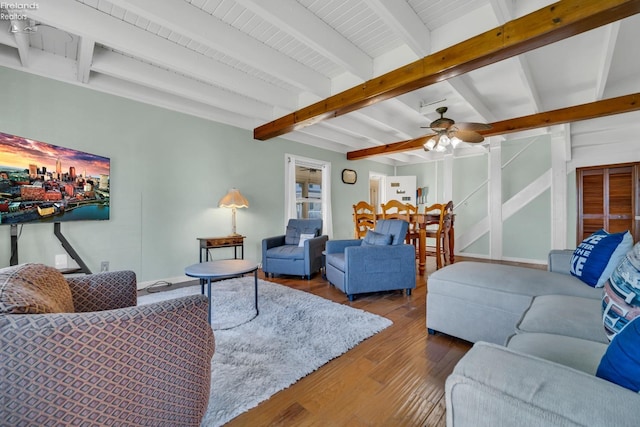 living room with wood-type flooring, beam ceiling, and ceiling fan