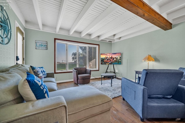 living room with hardwood / wood-style floors and beam ceiling