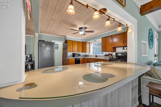 kitchen with wooden ceiling, beamed ceiling, sink, black appliances, and ceiling fan