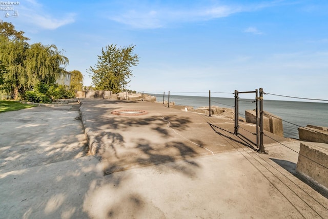 view of home's community with a water view