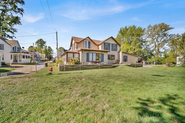 english style home featuring a front yard