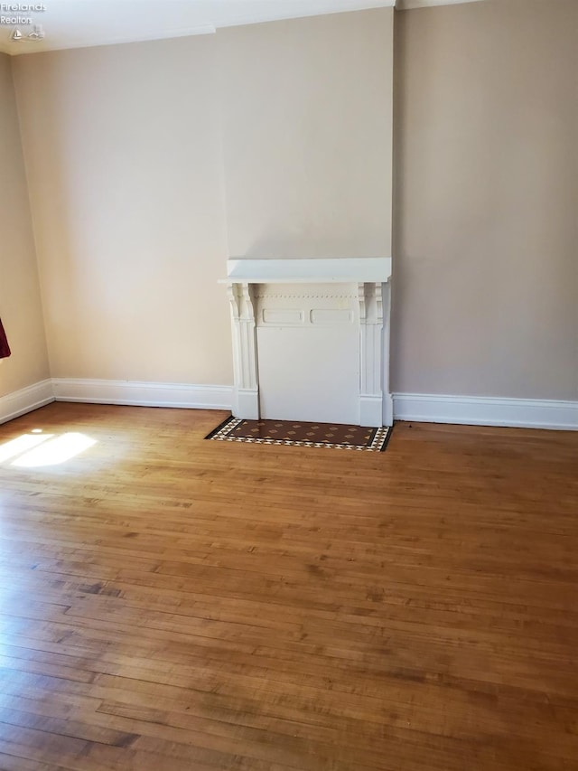 unfurnished living room with hardwood / wood-style floors