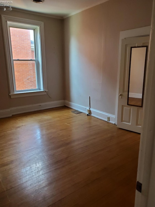 unfurnished room with light hardwood / wood-style floors