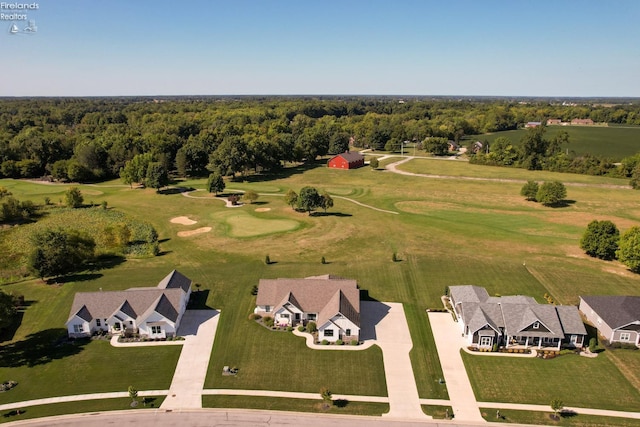 bird's eye view with a wooded view