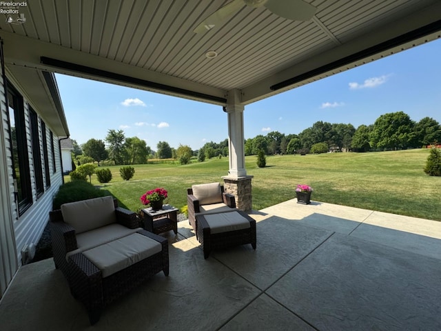 view of patio featuring outdoor lounge area and a ceiling fan