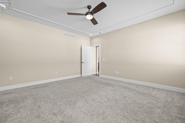 unfurnished room featuring visible vents, baseboards, ceiling fan, and carpet flooring