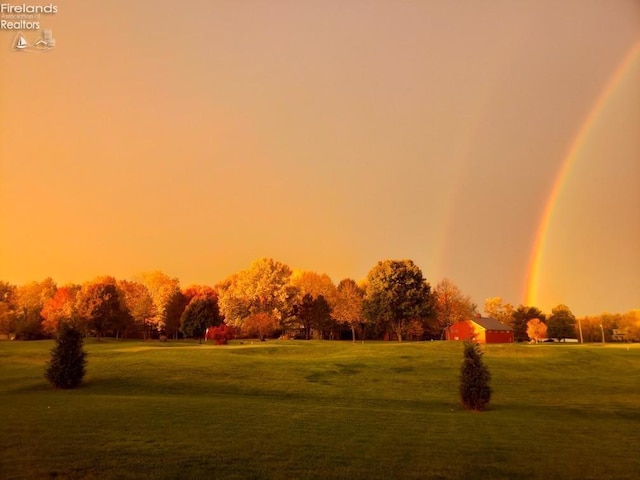 view of property's community with a lawn