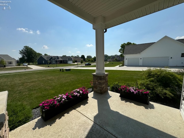 view of yard with a residential view and a porch