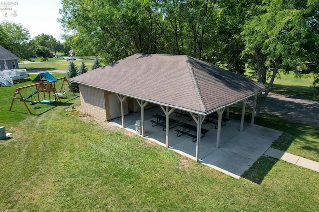 exterior space featuring a carport and a playground