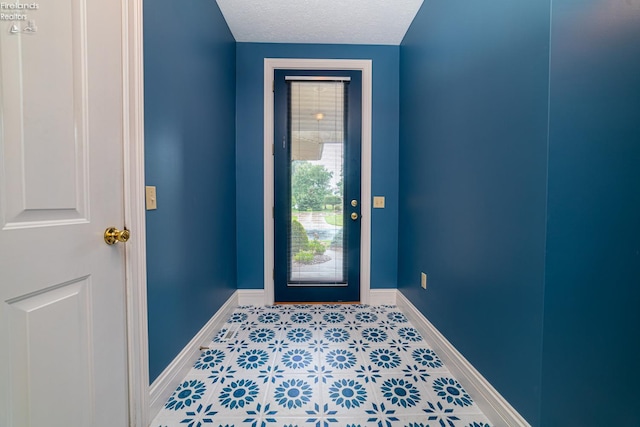 entrance foyer featuring a textured ceiling