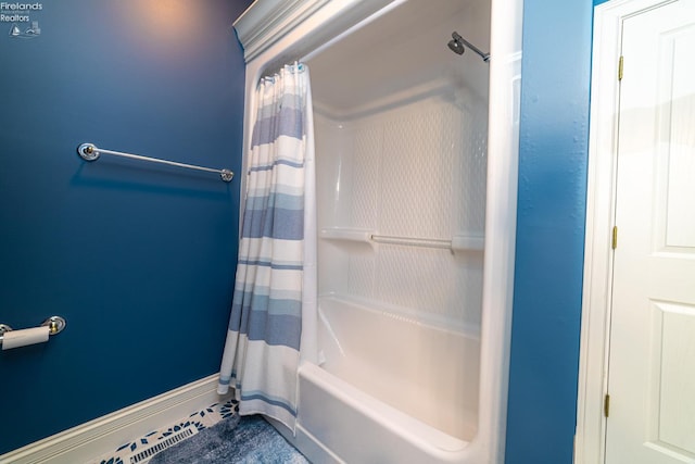 bathroom with shower / tub combo with curtain