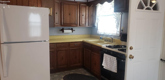 kitchen with sink and white appliances