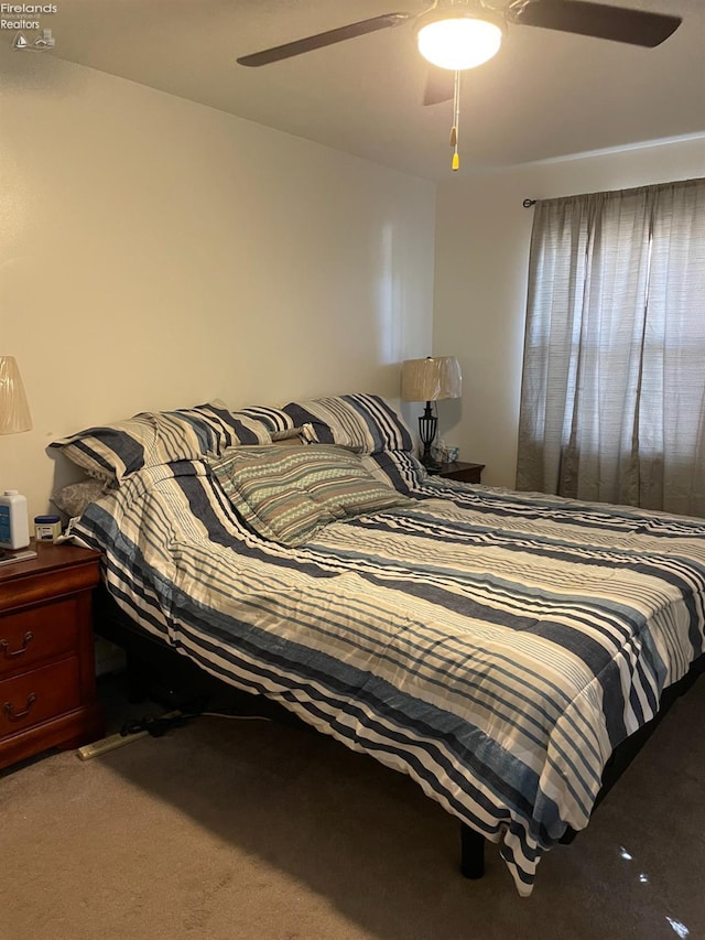 carpeted bedroom with ceiling fan