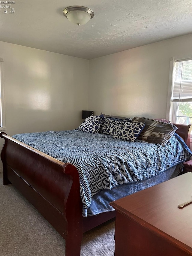 bedroom featuring a textured ceiling