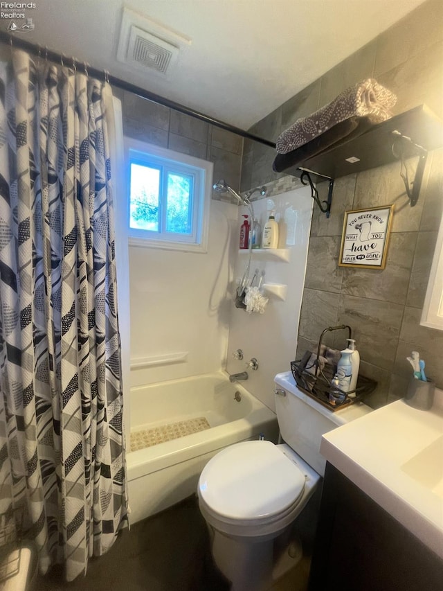 full bathroom featuring tile walls, toilet, vanity, and shower / bathtub combination with curtain