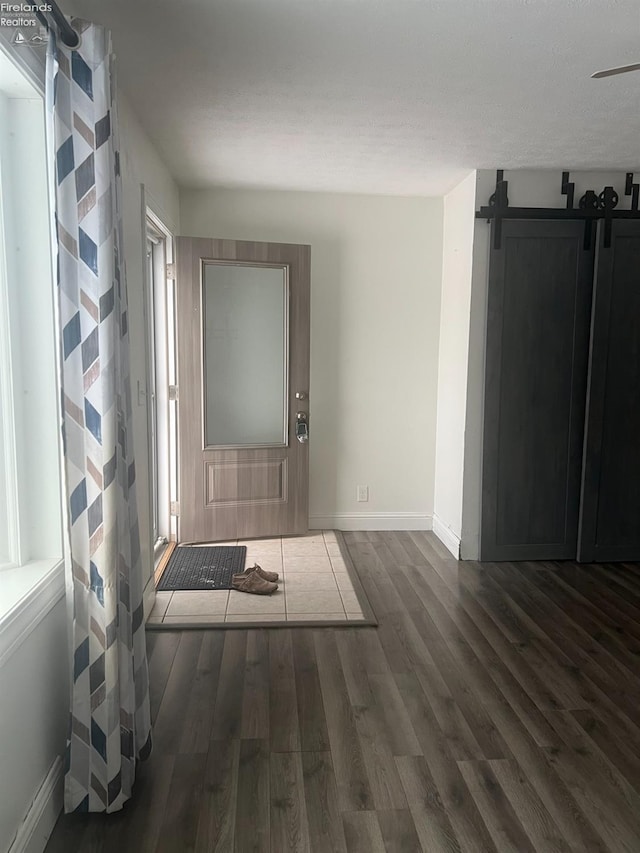 entrance foyer featuring dark hardwood / wood-style floors