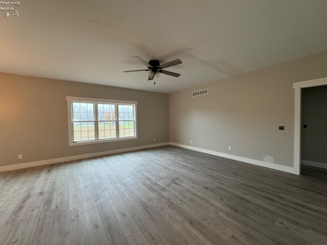 10 Eagle View Dr, Monroeville, OH 44847 - empty room with a ceiling fan, wood finished floors, and baseboards