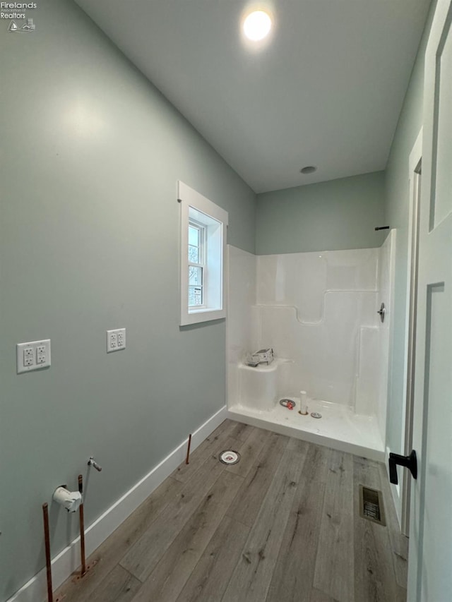 10 Eagle View Dr, Monroeville, OH 44847 - bathroom with wood finished floors, baseboards, and a shower